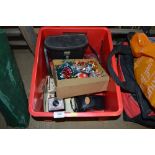 A box containing Christmas decorations; badges; bi