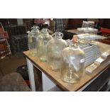 Four glass demijohns