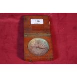 A wooden cased compass