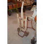 A wooden and metal sack barrow