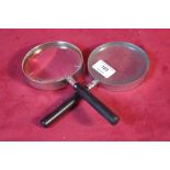 Two hand held magnifying glasses