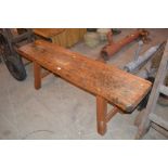 A large wooden bench, (possibly pig killing bench)