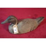 An old wooden decoy duck