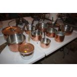 A large set of Normandy copper saucepans and frying pans, two with lids (11)