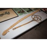 A carpet beater and a corn dolly