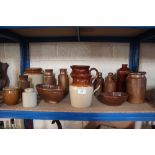 Two stoneware jugs; various stoneware jars and bot
