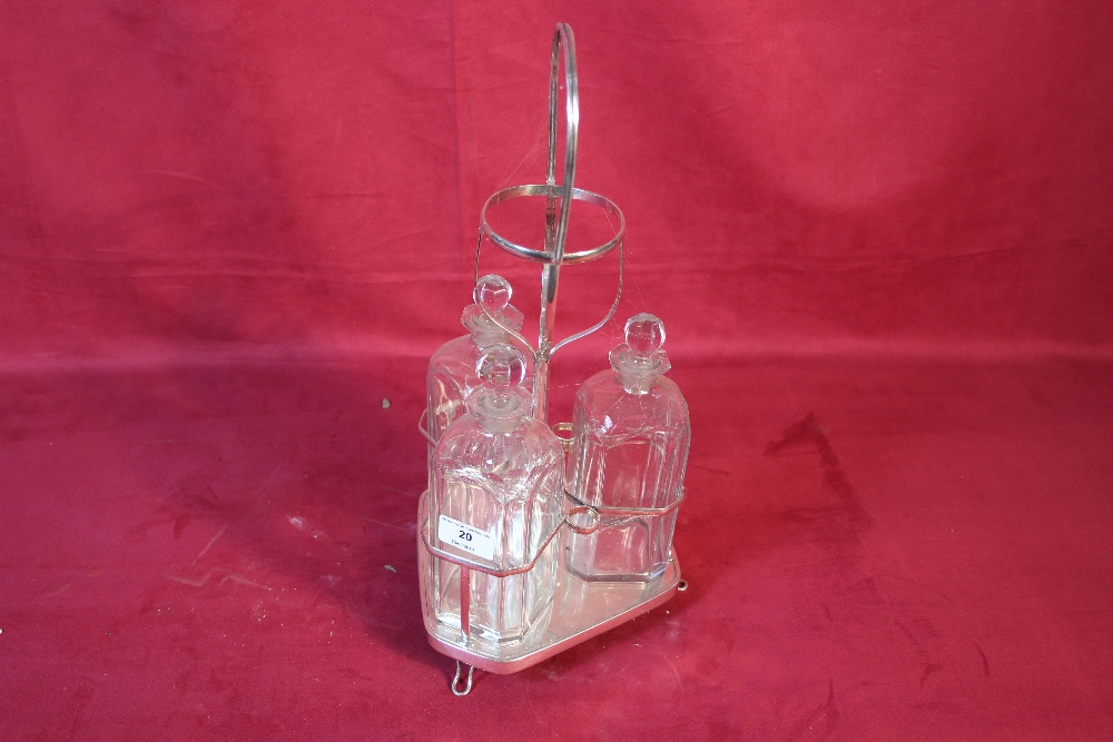 A plated three bottle decanter stand