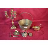 A brass jam pan; an ornate brass candle stand and