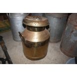 A brass milk churn by Unigate Creamery