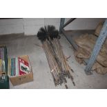 A quantity of cane drainage rods and chimney sweep
