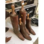 Two pairs of ladies leather boots with wooden trees