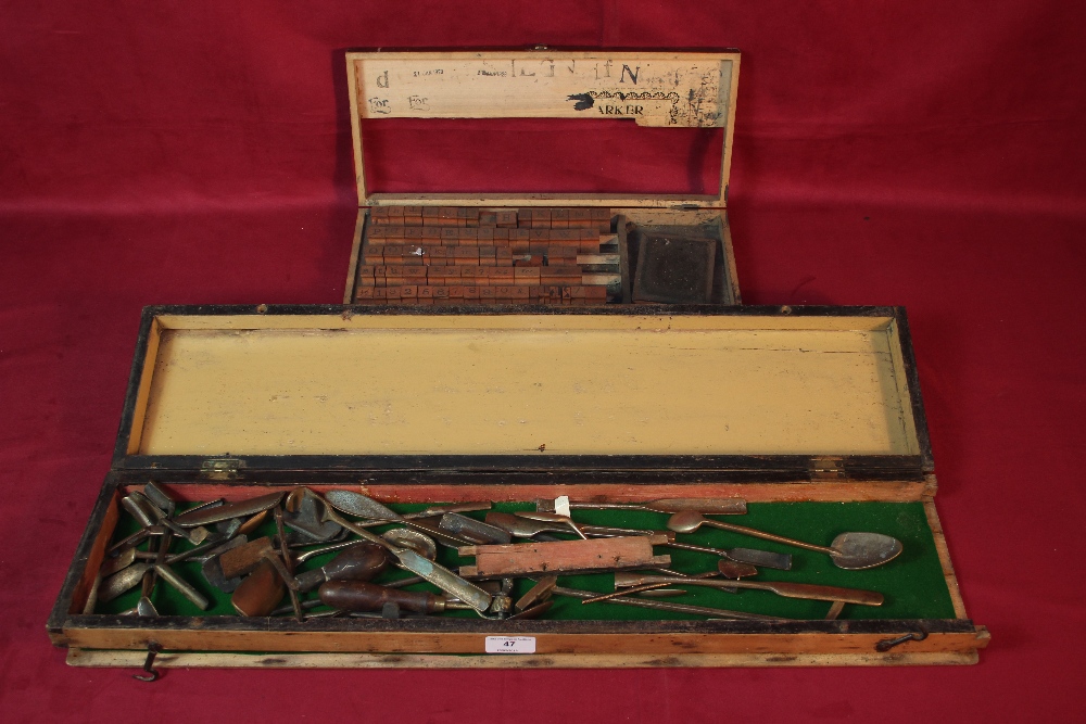 A tray of sculptors tools and a tray of wooden pri