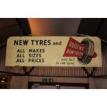 A "New Tyres and Regents Remoulds" advertising sign,