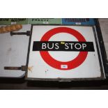 A vintage underground 'Bus Stop' sign in a metal f