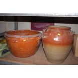 A large earthenware pot and a large stoneware jar