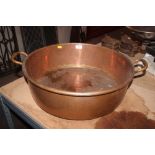 A large copper jam pan