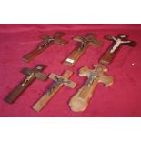 Six small wooden crucifix's of various shapes