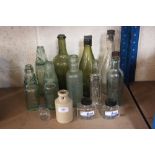 A quantity of old collector's bottles