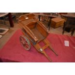A wooden toy farm wagon by F.H. Ayres