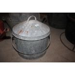 A galvanised egg collection bucket with wire inset