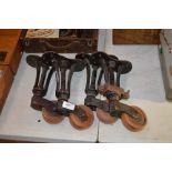 A set of cast iron and wooden trolley wheels