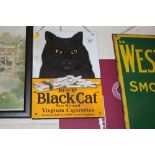 A "Black Cat Virginia Cigarettes" enamel advertising