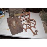 Two harness racks and an old weighing scoop