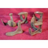 Five various cast iron shoe lasts