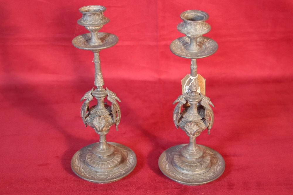 A pair of Victorian spelter candlesticks with Grif