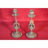 A pair of Victorian spelter candlesticks with Grif