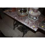 A marble topped garden table with "New Home" ornate