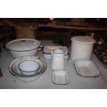 A quantity of enamel ware including jugs, bowls et
