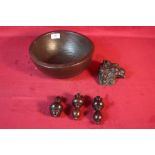 A 19th Century elm dairy bowl; a lion carving and three rosewood cord pulls