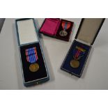 Two cased Czechoslovakian medals and one other med