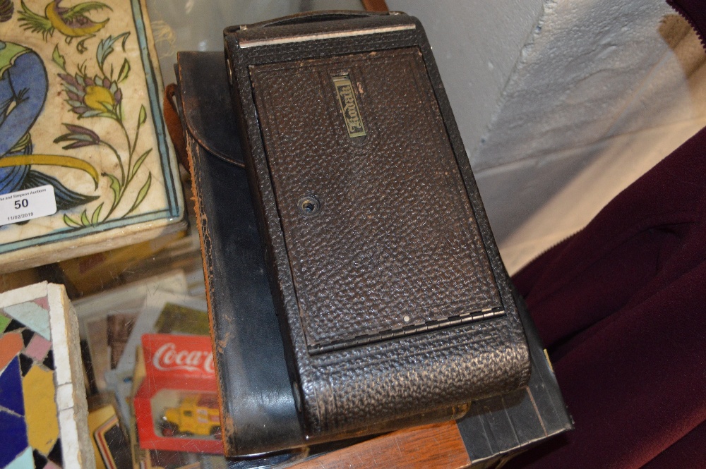 A large Kodak camera with carrying case