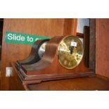 A West German mahogany three hole mantel clock; an