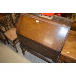 A 20th Century oak two drawer bureau