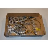 A tray of costume necklaces and jewellery