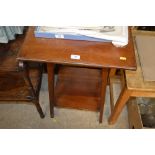 An Edwardian mahogany two tier square top table