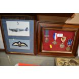 A framed and glazed collection of four medals and