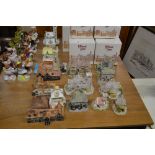 A collection of Lilliput Lane model houses and pot
