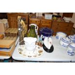 An enamel bread bin together with a lamp in the fo