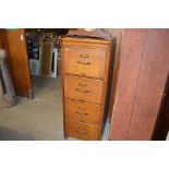 An early 20th Century wooden four drawer filing cabinet by Kenrick & Jefferson Ltd.