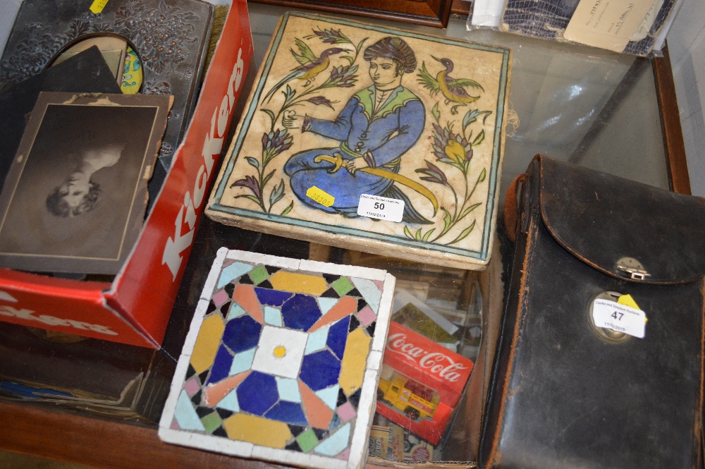 A large pottery Eastern style tile decorated with