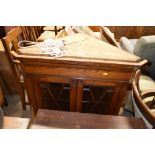 A good quality oak and glazed corner cabinet