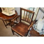 A George III elm rail back elbow chair