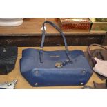 A Michael Kors blue handbag