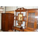 A late Victorian oak and mirrored hall stand with