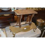 A small rustic wooden stool; a brass footman and a