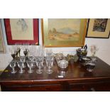 A quantity of various drinking glasses; a silver p